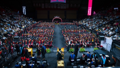 View from the stage looking out over the seated graduating students.