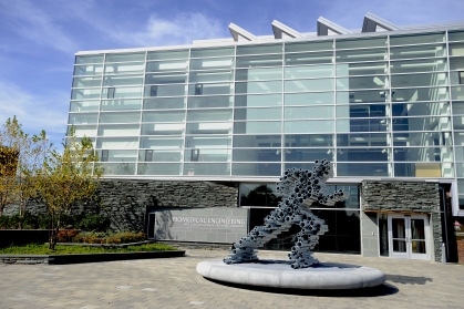 running man sculpture made of pipes in front of biomedical engineering building 